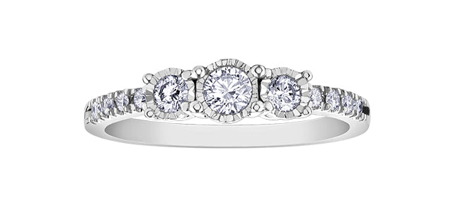 Diamond ring with multiple stones on a white background