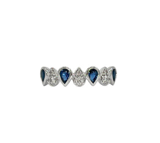 Jewelry item with blue gemstones and clear stones on a white background