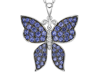 Butterfly pendant with blue gemstones on a white background