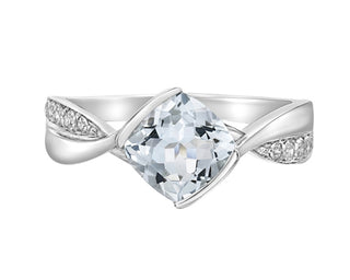 Silver ring with a large clear gemstone on a white background