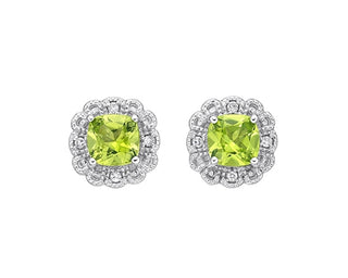 Pair of earrings with green gemstones on a white background