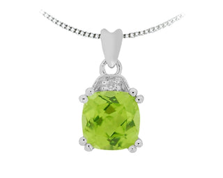 Peridot pendant with silver chain on a white background