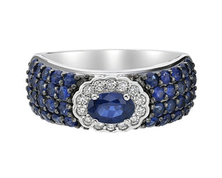 Silver ring with blue gemstones on a white background