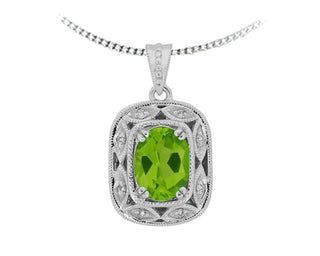 Silver pendant with green gemstone on a white background