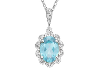 Silver pendant with a blue gemstone on a white background