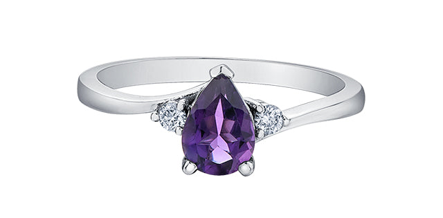 Silver ring with a purple gemstone and small diamonds on a white background