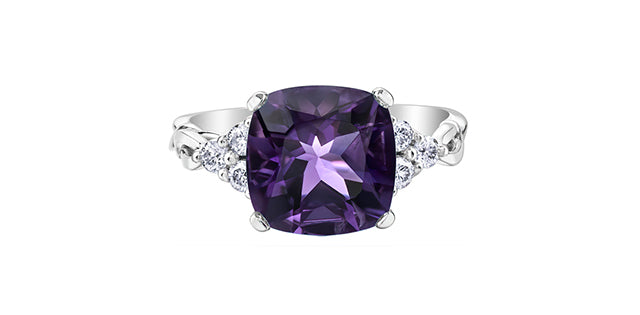 Ring with a purple gemstone on a white background