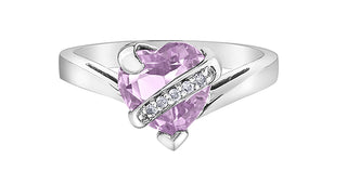 Silver ring with a pink heart-shaped gemstone on a white background