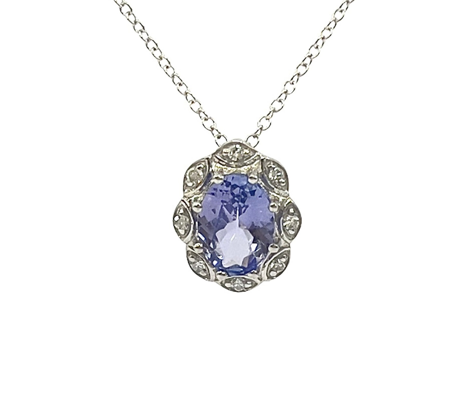 Silver necklace with a purple gemstone pendant on a white background