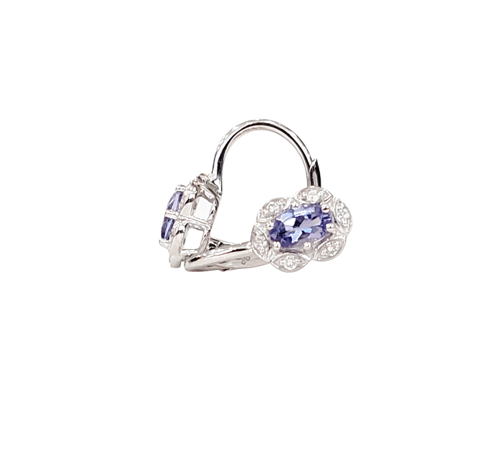 Silver hoop earrings with blue gemstones on a white background