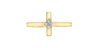 Gold cross pendant with a diamond at its center on a white background