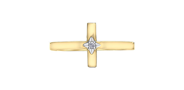 Gold cross pendant with a diamond at its center on a white background