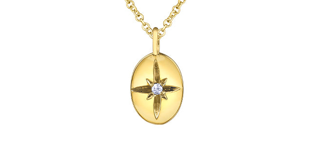 Gold pendant with star design and diamond on a white background