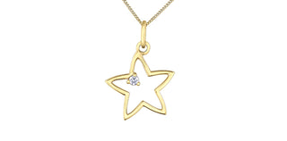 Gold star-shaped pendant with a diamond on a white background