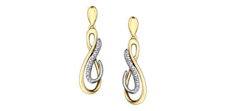 Gold and silver infinity-shaped earrings on a white background