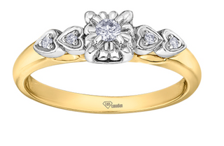 Gold and silver ring with diamond accents on a white background