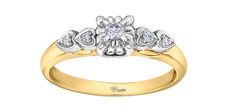 Gold and silver ring with diamond accents on a white background