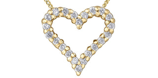 Gold heart-shaped necklace with diamonds on a white background