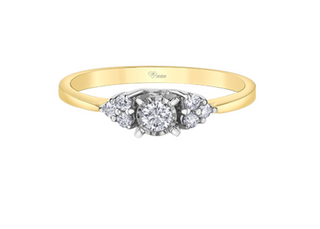 Gold ring with a diamond design on a white background