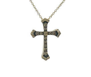 Gold cross pendant necklace on a white background