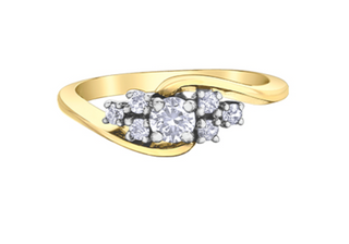 Gold ring with diamond accents on a white background