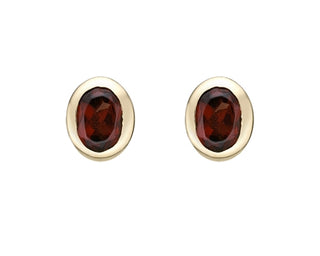 Aretes de granate de talla ovalada de 0,45 quilates en oro amarillo de 10 quilates