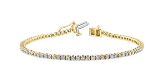 Gold bracelet with diamond accents on a white background