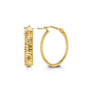 Gold hoop earrings on a white background