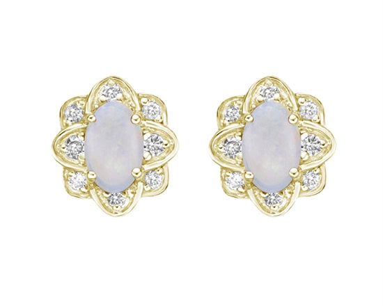 Pair of gold earrings with opal stones on a white background