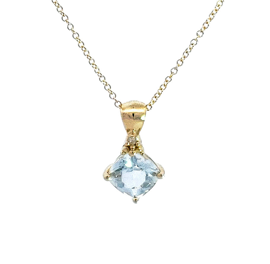 Gold necklace with a blue gemstone pendant on a white background