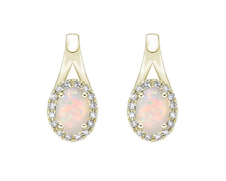 Pair of gold earrings with opal stones on a white background