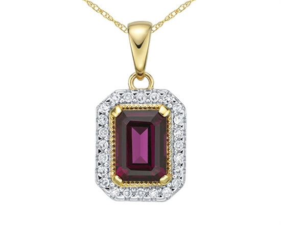 Gold pendant with a red gemstone and diamond accents on a white background