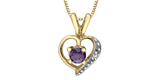 Gold heart-shaped pendant with a purple gemstone on a white background