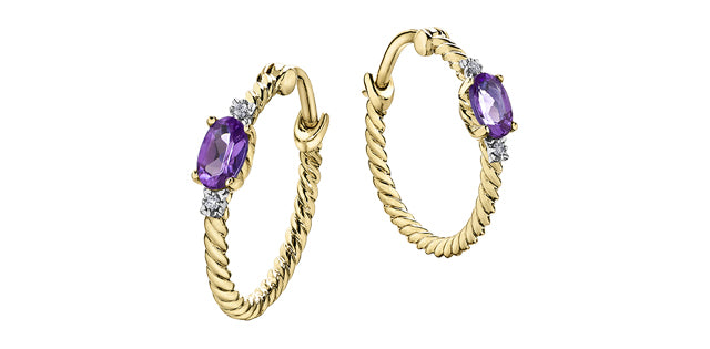 Gold hoop earrings with purple gemstones on a white background