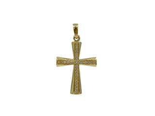 Gold cross pendant with embedded stones on a white background