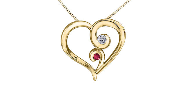 Gold heart-shaped necklace with a diamond and ruby on a white background