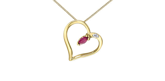 Gold heart-shaped necklace with a red gemstone on a white background