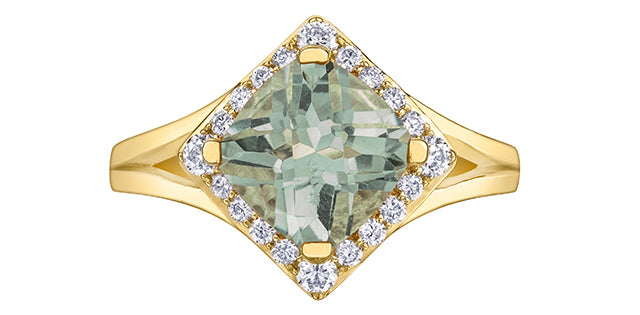 Gold ring with a green gemstone and diamond accents on a white background