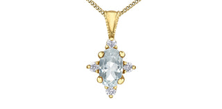 Gold pendant with a central clear gemstone and smaller diamonds on a white background