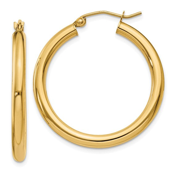 Gold hoop earrings on a white background