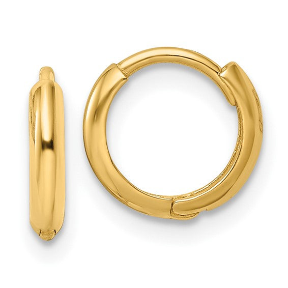 Gold hoop earrings on a white background