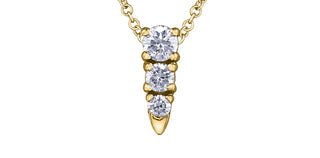 Gold necklace with three clear gemstones on a white background