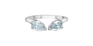 Silver ring with two pear-shaped gemstones on a white background