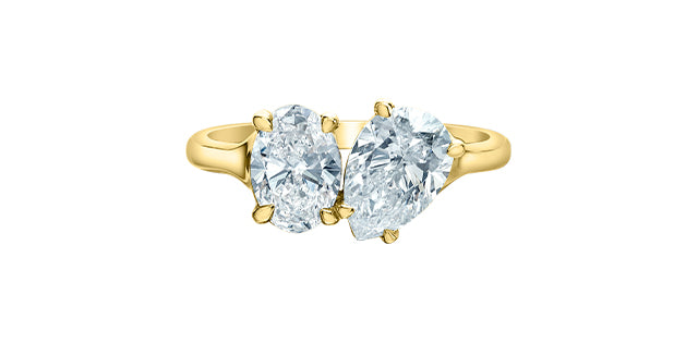 Gold ring with two heart-shaped diamonds on a white background