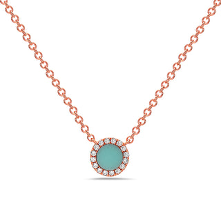 Necklace with a turquoise pendant and rose gold chain on a white background