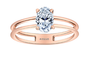 Rose gold ring with a large diamond on a white background