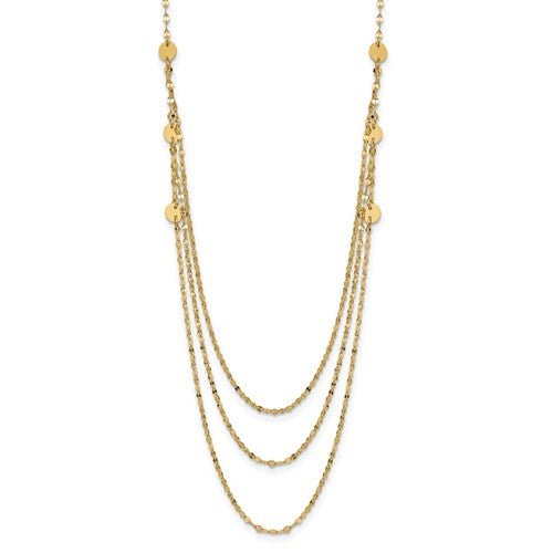 Gold necklace with multiple strands on a white background