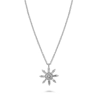 Star-shaped diamond pendant on a chain against a white background