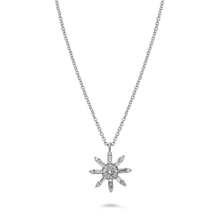 Star-shaped diamond pendant on a chain against a white background