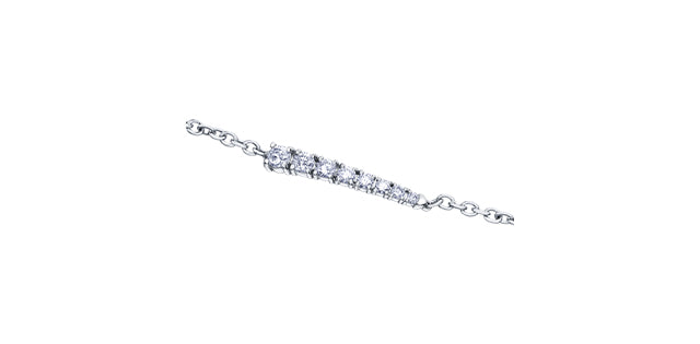 Silver bracelet with clear stones on a white background